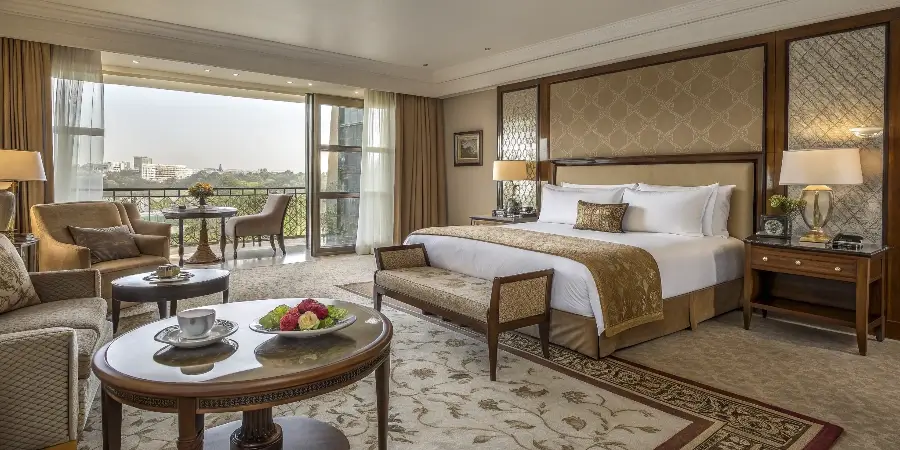 A comparison image showing furniture from an economy, mid-range, and luxury hotel room